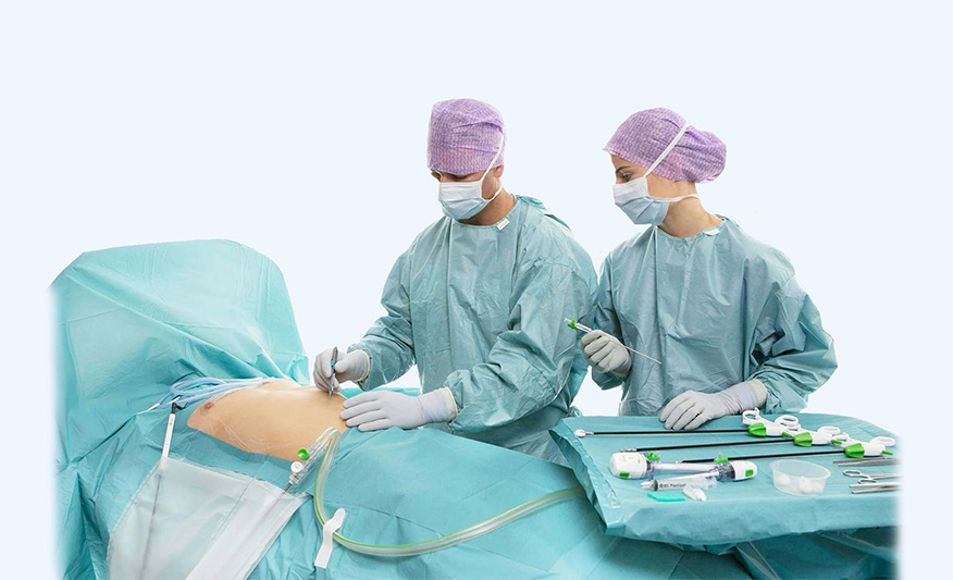 A wide-angle photo of a doctor starting to perform Laparoscopy